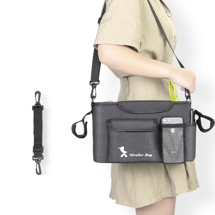 Praktisk vognbag i svart, designet for effektiv organisering av flasker, bleier og personlige eiendeler.