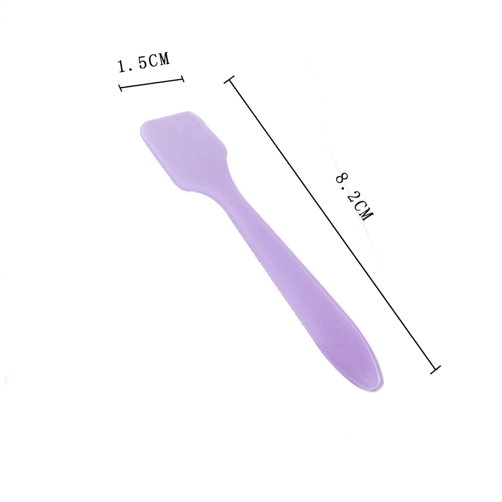 Reisevennlig kosmetikkspatel i mini-størrelse, perfekt for hygienisk krempåføring hjemme eller på farten.