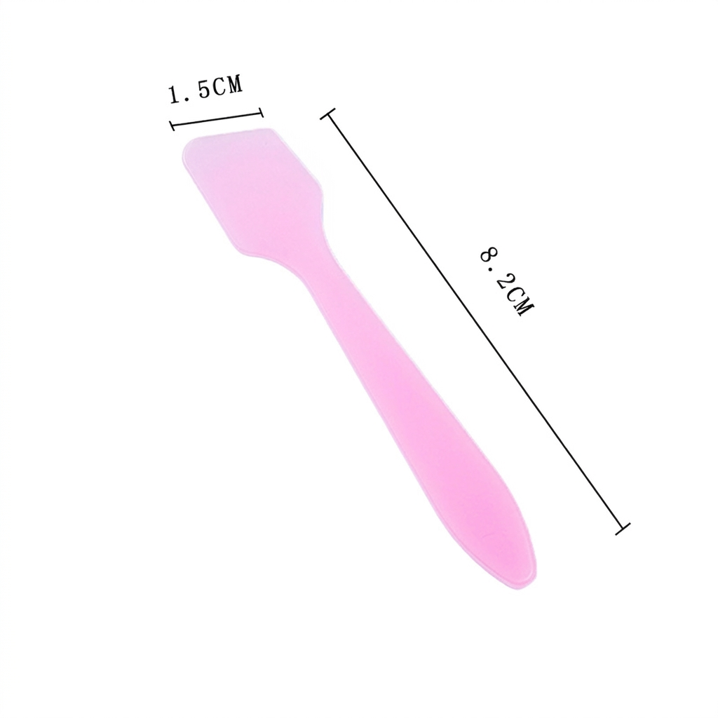 Hygienisk kremspatel av plast, ideell for å forhindre bakterier i din kosmetikk og hudpleie.