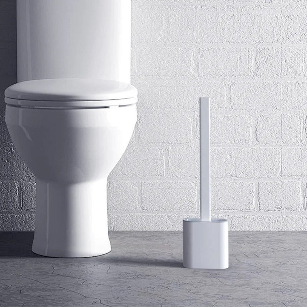 Veggopphengt silikon toalettbørste; ergonomisk design for effektiv og hygienisk baderomsrengjøring.
