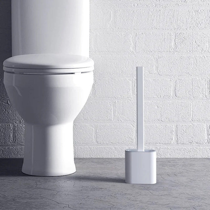 Veggopphengt silikon toalettbørste; ergonomisk design for effektiv og hygienisk baderomsrengjøring.