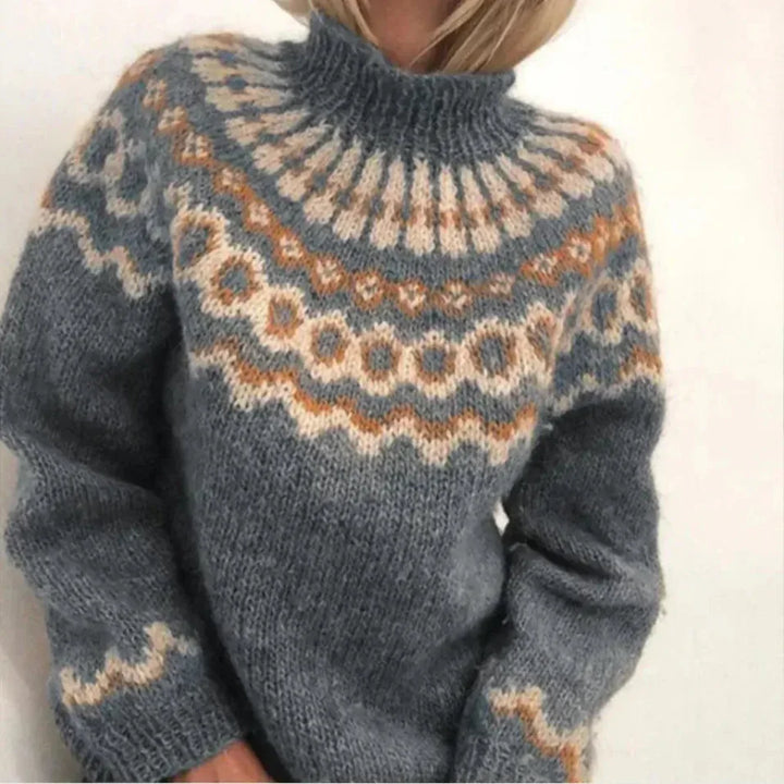 Elegant strikkegenser for kvinner med rund hals og lange ermer. Myk, varm og stilfull høst-/vintergenser i komfortabel strikk.