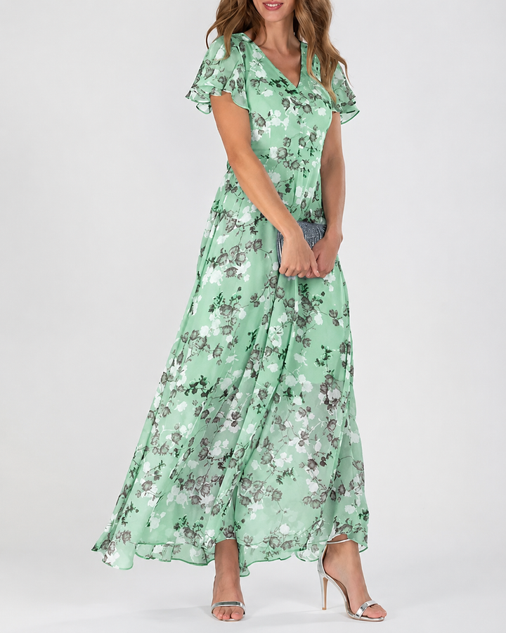 Stilig lang kjole for kvinner, blomstret design med V-hals og flatterende ermer, feminin look.