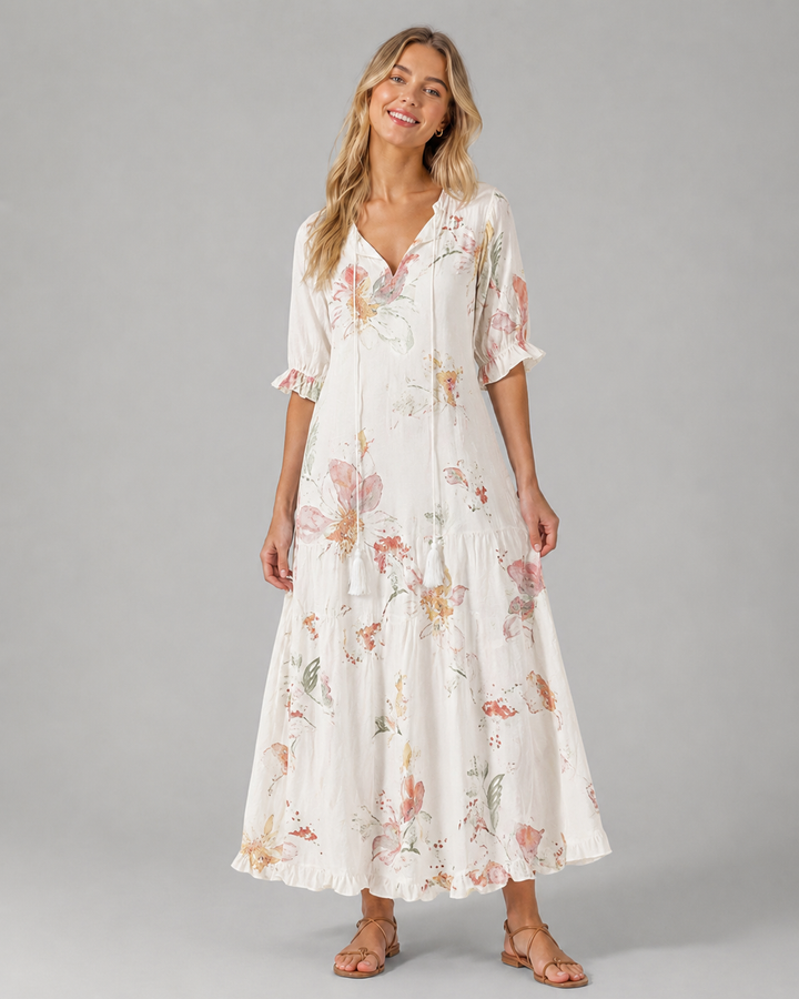 Sjarmerende kvinnesommerkjole, boho vintage stil med V-hals, blomstermønster og ermeløs. En flott hverdagskjole.