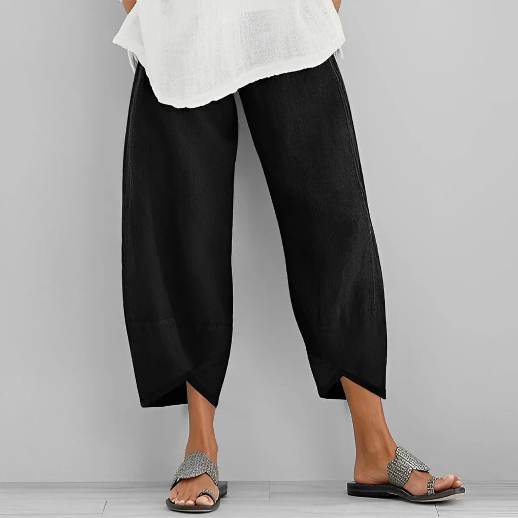 Elegante satengbukser for dame med vide ben og høy midje, perfekt til fest eller hverdag.