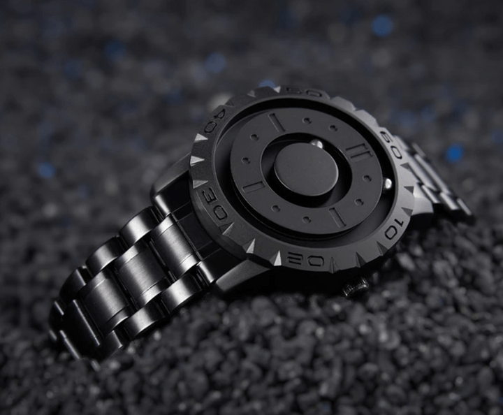 Elegant magnetisk herreklokke med minimalistisk urskive og taktil tidsvisning, menns armbåndsur.