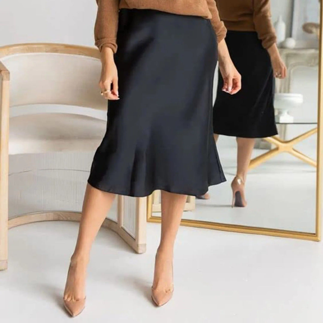 Dame skjørt, A-linjeformet og knelangt. Høy midje gir et elegant og tidløst preg til enhver garderobe.
