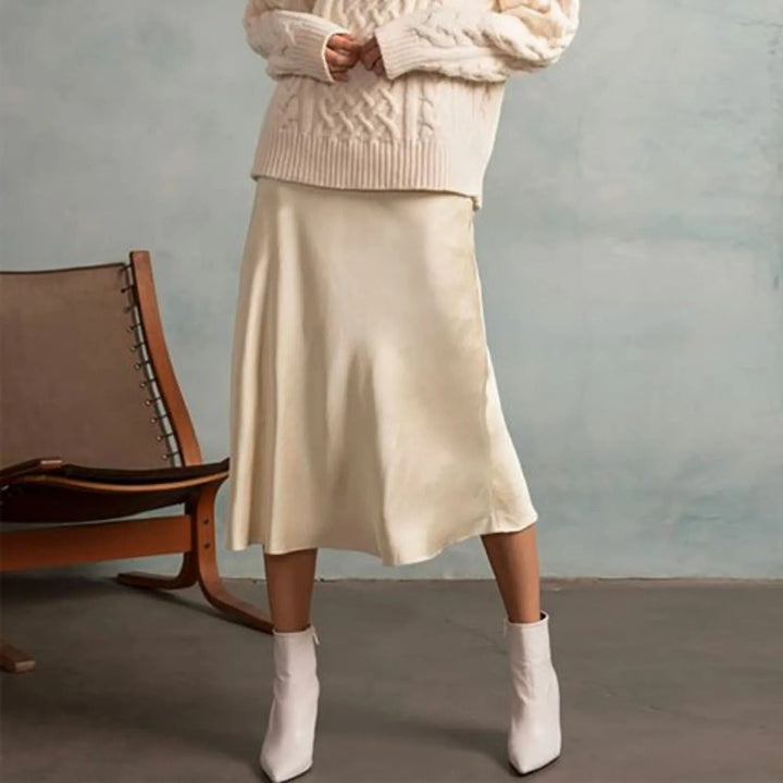 Tidløst A-linjeskjørt, knelangt og allsidig. Perfekt for kvinner som ønsker en elegant look på kontoret eller fritid.