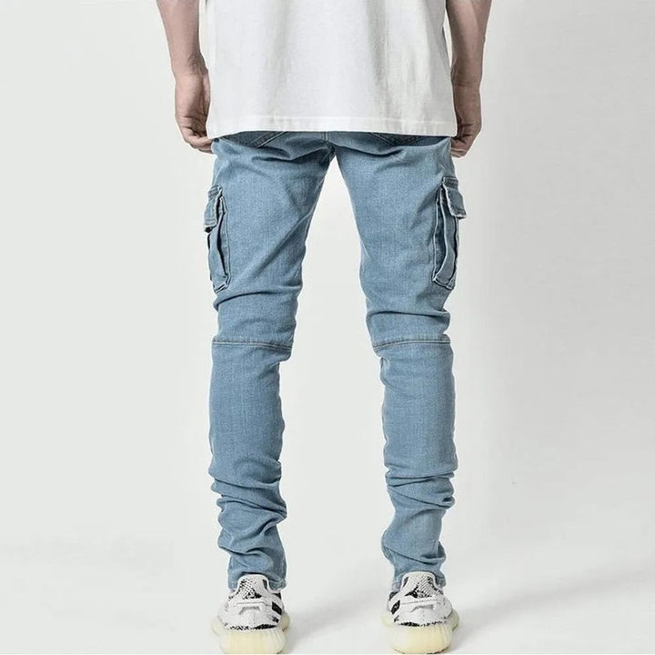 Slim fit blå jeans for menn, elastisk og komfortabel. Perfekt for en moderne og avslappet stil.