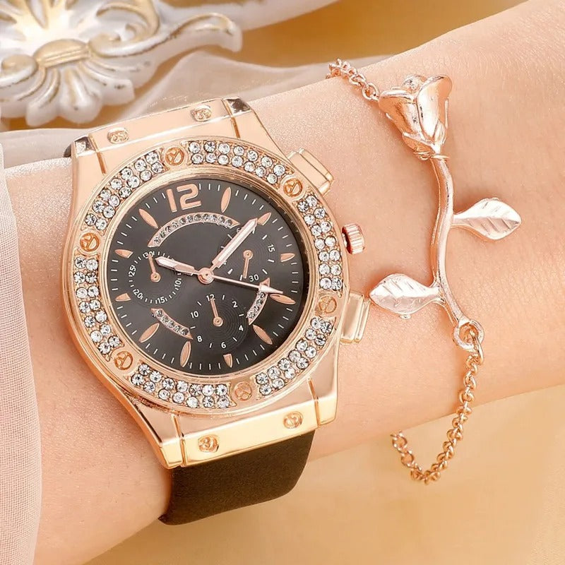 Kvinne bærer luksuriøst rhinestone armbåndsursett, elegant og stilrent tilbehør.