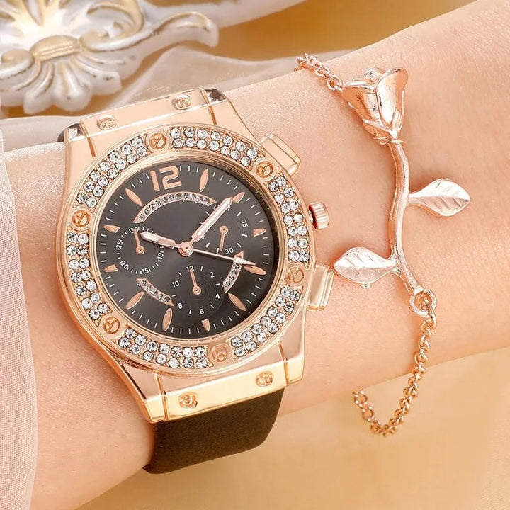 Kvinne bærer luksuriøst rhinestone armbåndsursett, elegant og stilrent tilbehør.