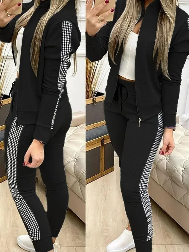 Kvinners svarte treningsdress med moderne snitt, elegant stil og optimal komfort for enhver anledning.