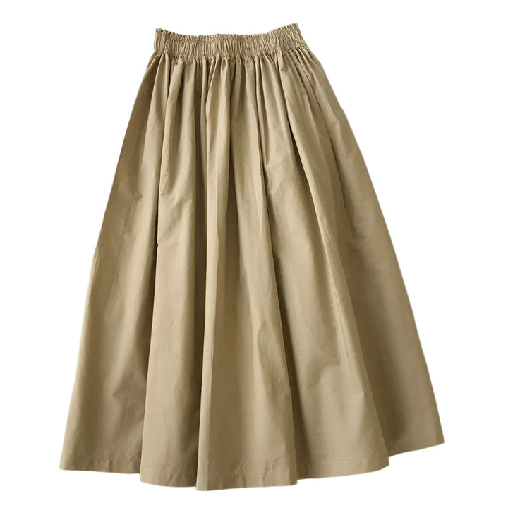 Allsidig plissert A-linje midiskjørt for dame, elegant og tidløst. Ideelt for sommer og hverdag.