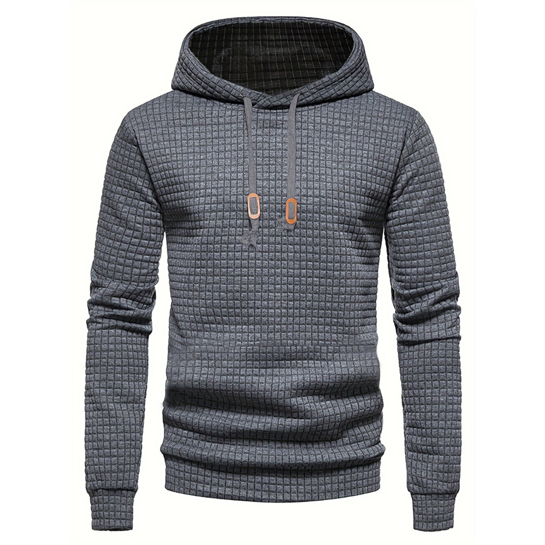 Uformell menns hettegenser med lappeteppe-design. Perfekt for hverdagskomfort og trendy mote.