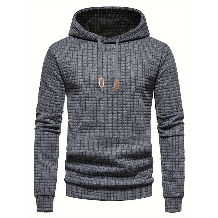 Uformell menns hettegenser med lappeteppe-design. Perfekt for hverdagskomfort og trendy mote.