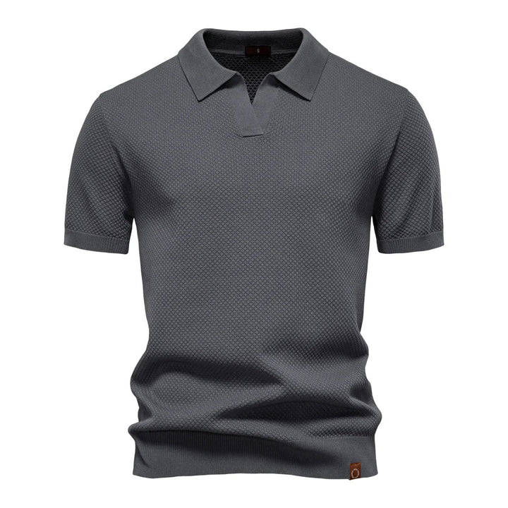 Stilfull herre poloskjorte, klassisk design med korte ermer. Ideell for fritid og en pen casual look.