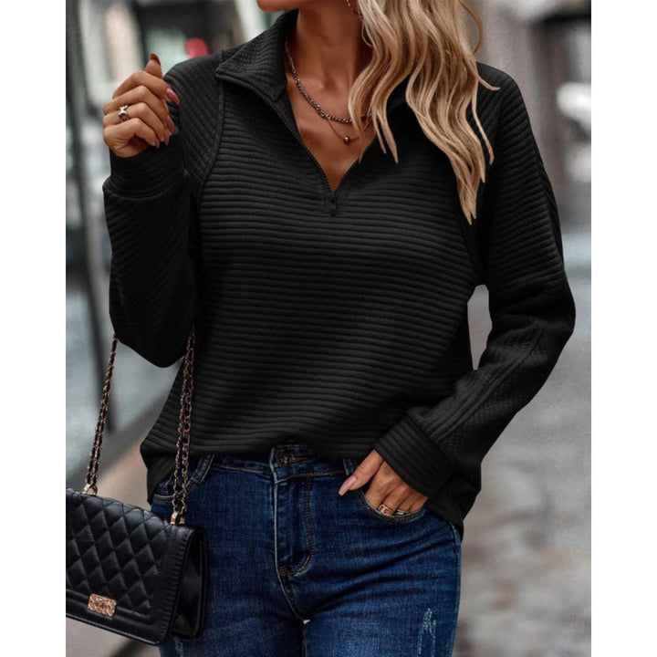 V-hals damegenser i en dypere farge. Elegant, allsidig strikk som matcher ulike antrekk.