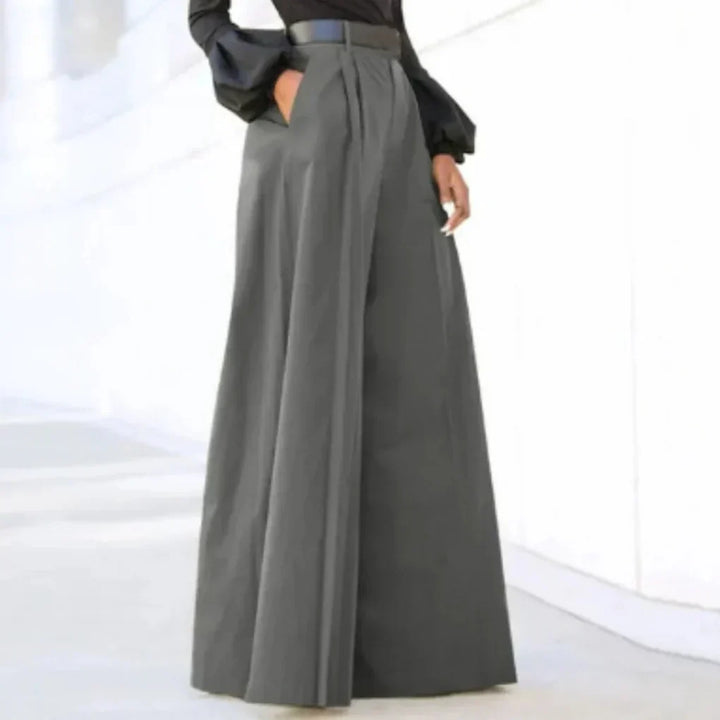 Allsidig kvinners brede bukse for vår/sommer. Ensfarget design med høyt liv for elegant eller casual antrekk.