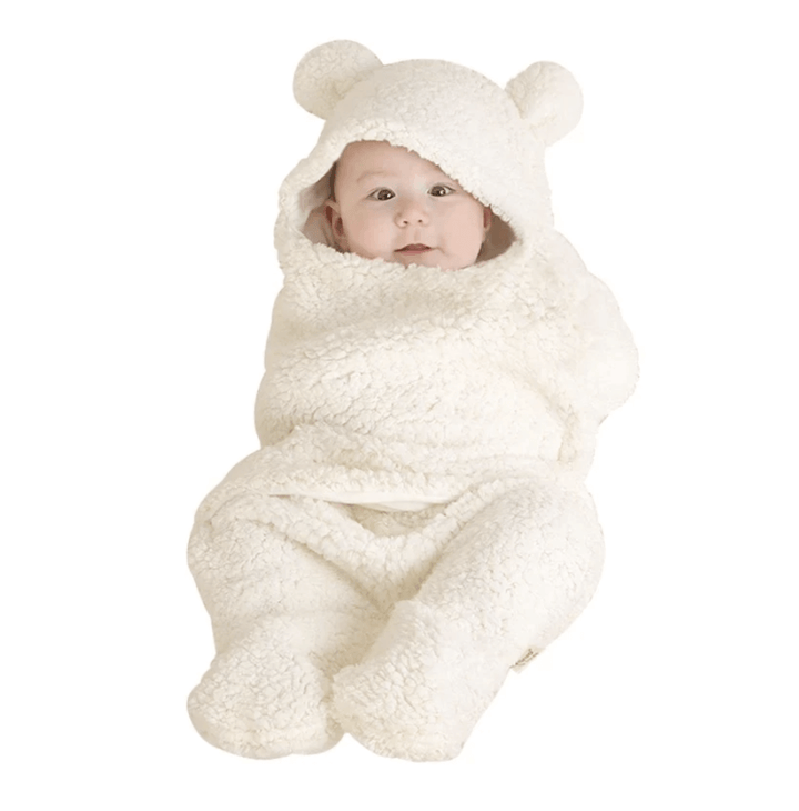 Myk og varm baby sovepose i ull for trygg og komfortabel søvn.