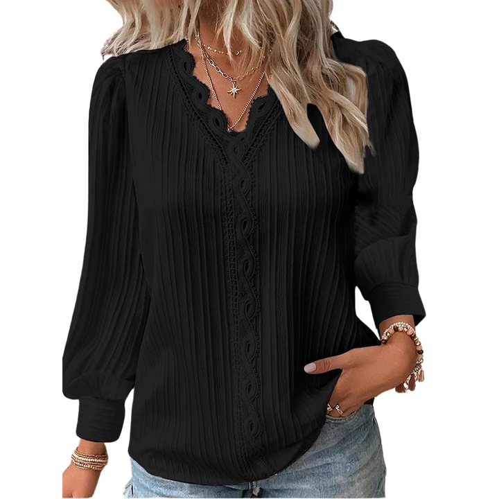Trendy blondetopp med V-hals for damer. Løs passform sikrer komfort og stil hele dagen.