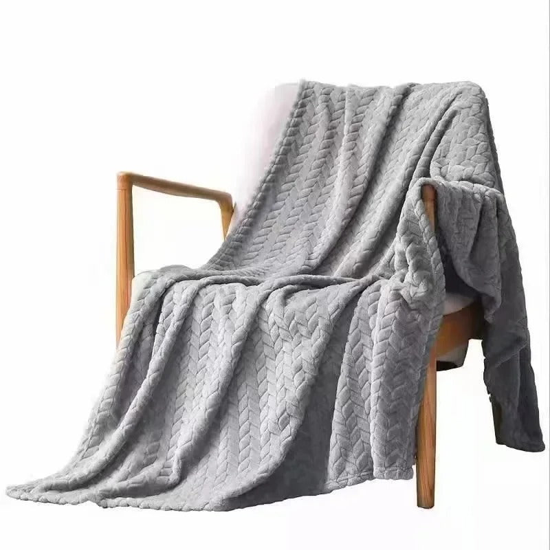 Elegant korallfløyel pledd, perfekt interiørdetalj som gir komfort og dekor i hjemmet.