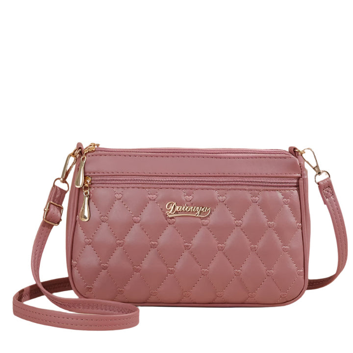 Brodert crossbody veske for kvinner i elegant PU skinn med unikt blomstermønster, perfekt for hverdag.