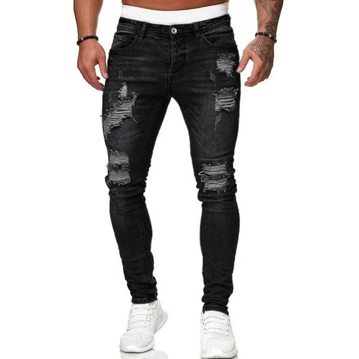 Figurnære skinny herrejeans i mørk denim med moderne rifter for en kul streetwear-stil.