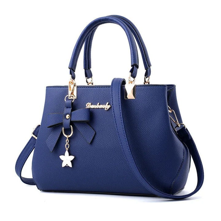 Dameveske med unikt blomstersjarme, perfekt som crossbody eller messenger-veske. Stilren.