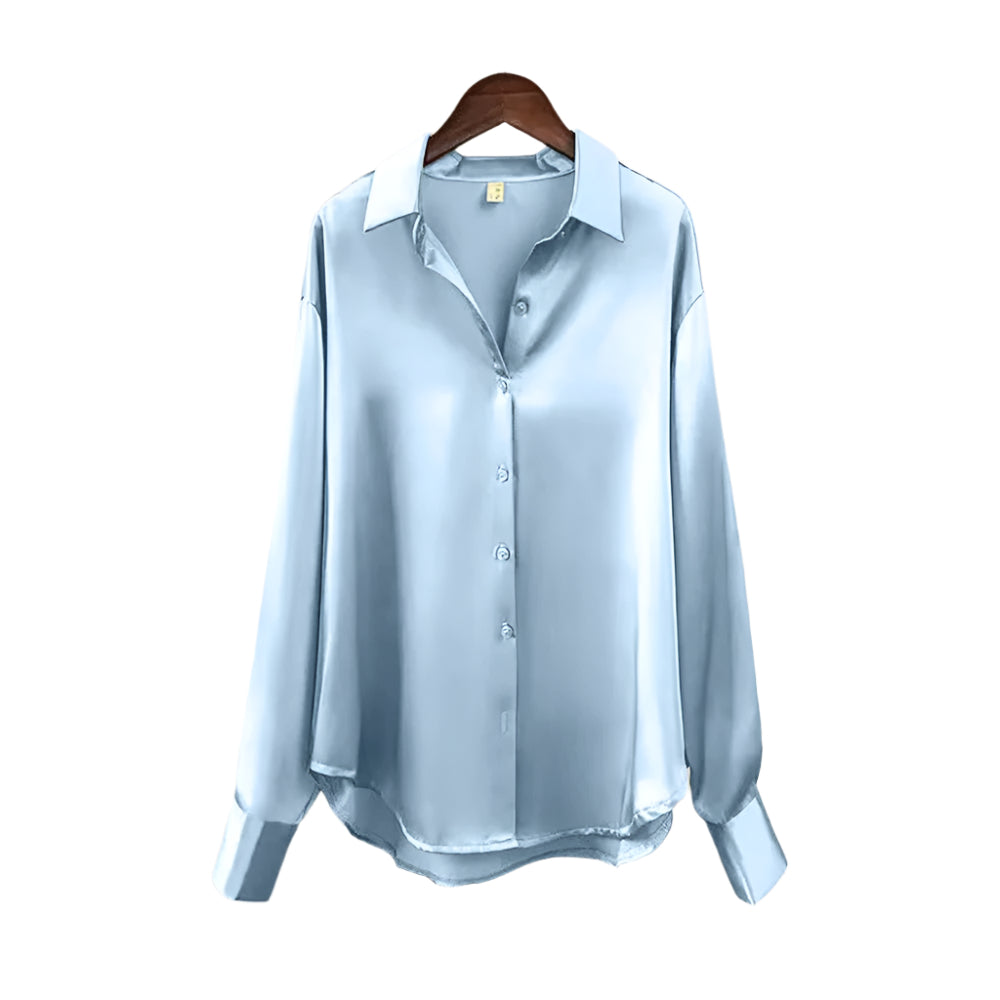 Sofistikert damebluse for jobbantrekk. Elegant design med knapper og reverskrage, langermet.