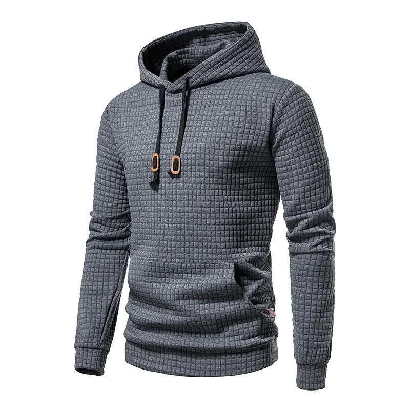 Stilig lappeteppe hettegenser for menn. Myk og behagelig pullover med hette og snøringsdetaljer.