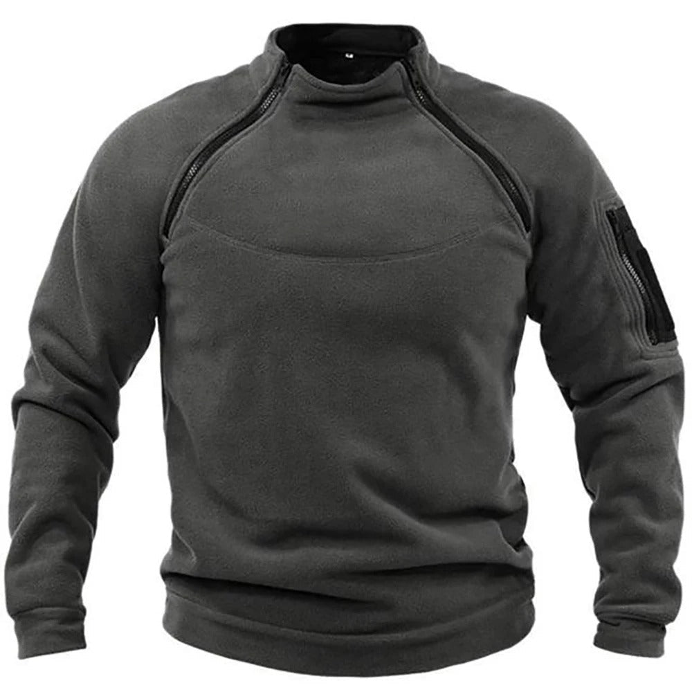 Bakfra: Herrejakke i taktisk fleece med praktiske lommer og robust design, ideell for utetøy og friluftsliv.