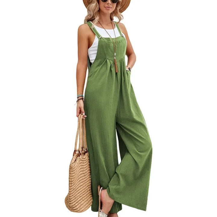 Ryggvisning av kvinner baggy bib jumpsuit, løs passform, vide ben, elegant og komfortabel kjeledress.