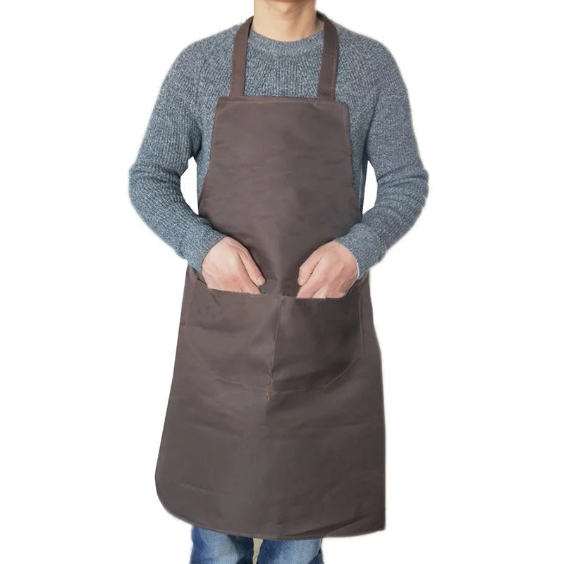 Praktisk vanntett kjøkkenforkle, unisex modell. Perfekt for matlaging, beskytter mot søl. Et must for kjøkkenutstyr.